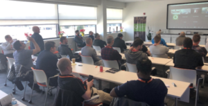 (Above) attendees look on and converse during the open hybrid discussion Q&A.