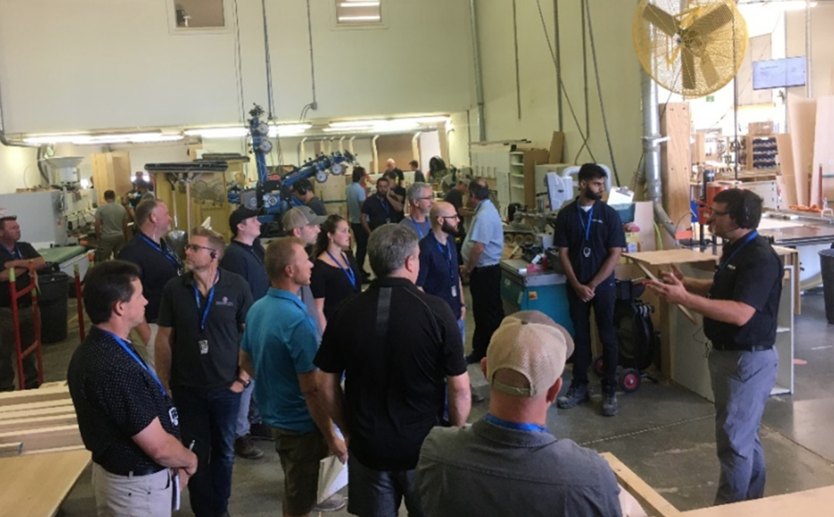 From above WMCO Members standing together in Woodland Horizon shop during plant tour focus group