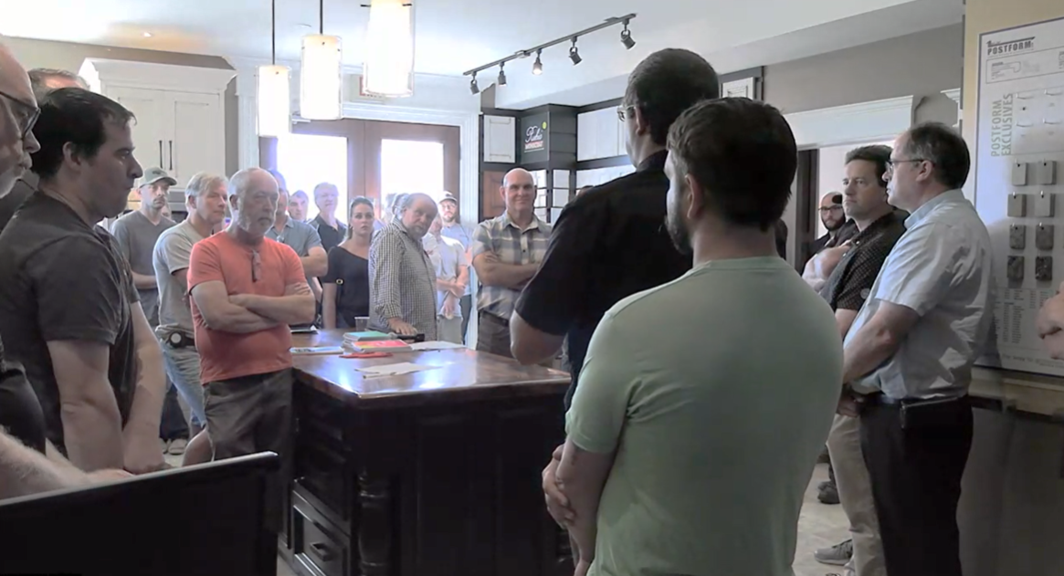 WMCO Members standing together in Woodland Horizon showroom during plant tour focus group